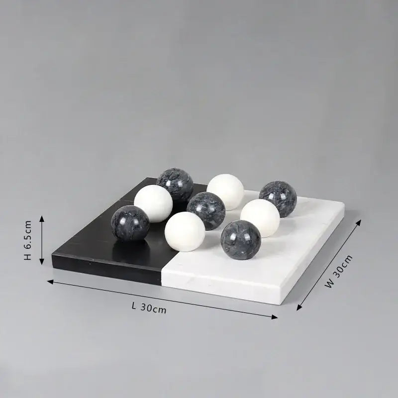 Modern geometric chess ornament set featuring black and white marble checkers with glossy spherical pieces for home decor