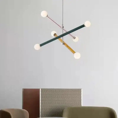 Modern geometric colorful chandelier art deco with intersecting matte green, wood, and rose gold rods with frosted globes