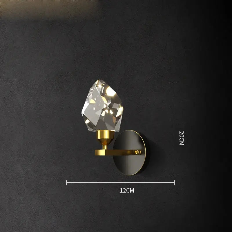 A sleek gold-toned wall sconce with faceted crystal gemstone for modern geometric crystal copper black led decorbites crystal copper