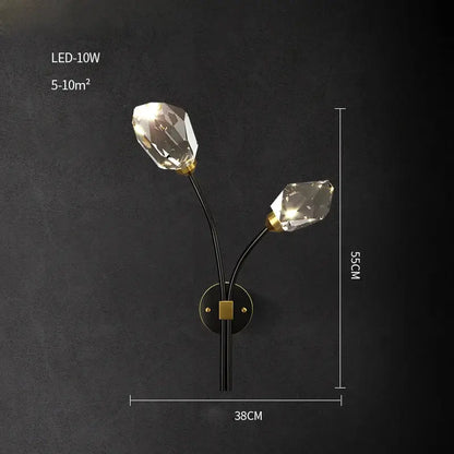 A sleek black wall sconce with two faceted crystal bulbs and gold-toned accents in crystal copper black led décorbites style