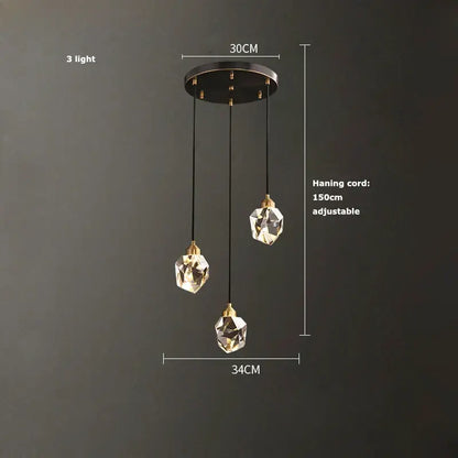 Modern three-light pendant chandelier with faceted crystal globes and brass copper black led accents for dining room decorbites crystal copper