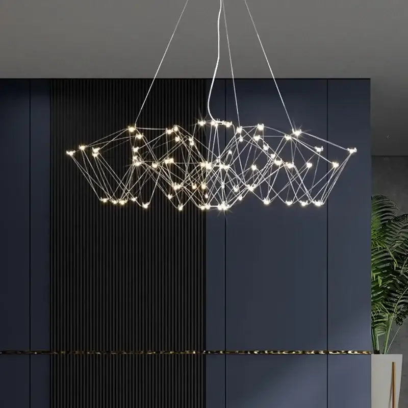 Modern geometric cube light pendant lamp featuring thin metallic wires with warm white led lights for dining room decorbites cube light