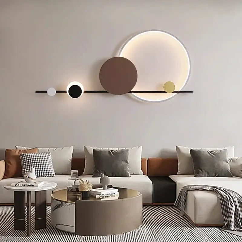 Modern geometric decorbites led wall sconce with sleek black bar and illuminated white brown gold circular lights for bedroom