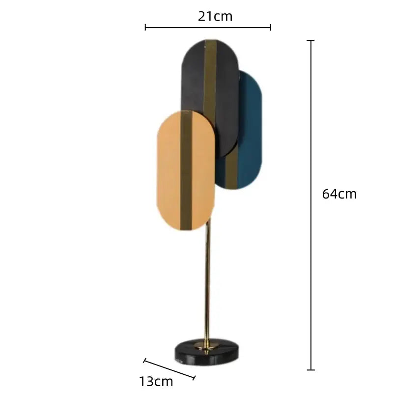 Modern geometric ellipse metal sculpture with overlapping black gold and teal panels featuring metallic stripes for home decor
