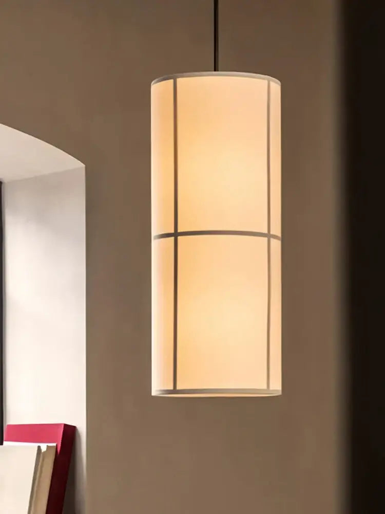 A modern geometric decorbites hashira cluster pendant light with a warm beige fabric shade for dining room use