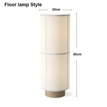 Cream-colored cylindrical fabric pendant light with wooden base featuring subtle vertical lines for modern decorbites hashira cluster
