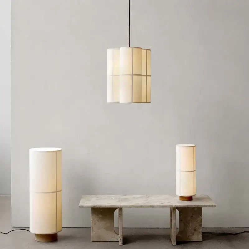 Cream-colored modern geometric fabric cluster pendant light and table lamps with wooden bases for dining and living rooms