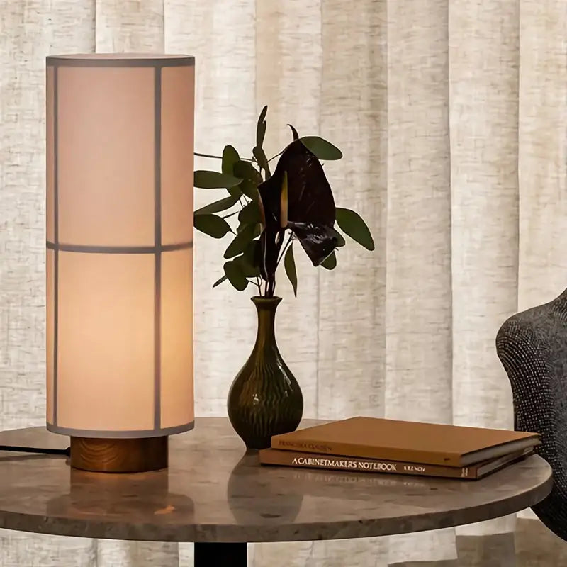 Warm-toned cylindrical table lamp with beige fabric shade and wooden base for modern geometric decorbites hashira cluster pendant light