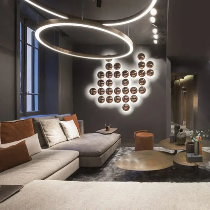Modern geometric glossy gold led wall sconces with warm illumination and sleek metallic finish for living room decor