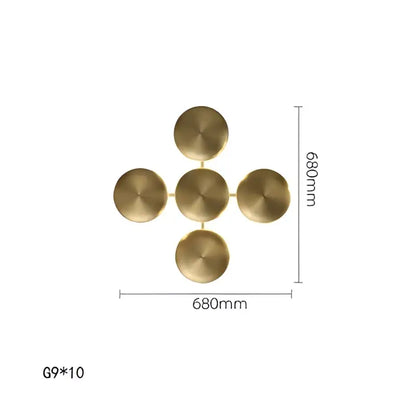 Gold-colored brass wall sconces with five circular discs in a cross pattern for modern glossy gold led wall decor