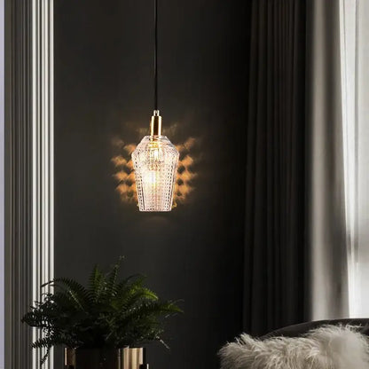 Modern geometric gold and clear crystal led ceiling chandelier with faceted glass pendant and gold-toned metal fixture