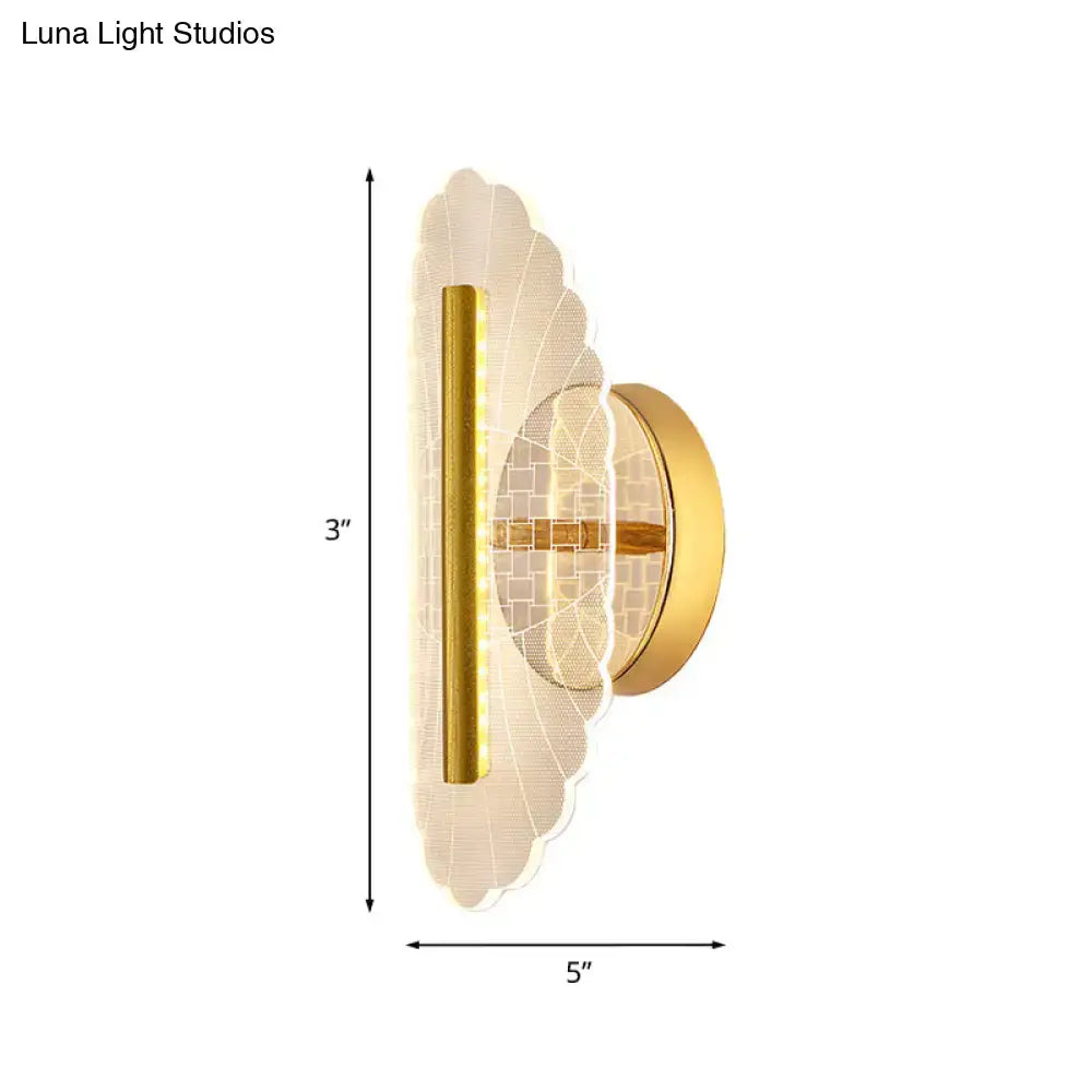 Modern geometric gold sconce light with a gold finish scalloped glass shade and vertical led strip for living room use