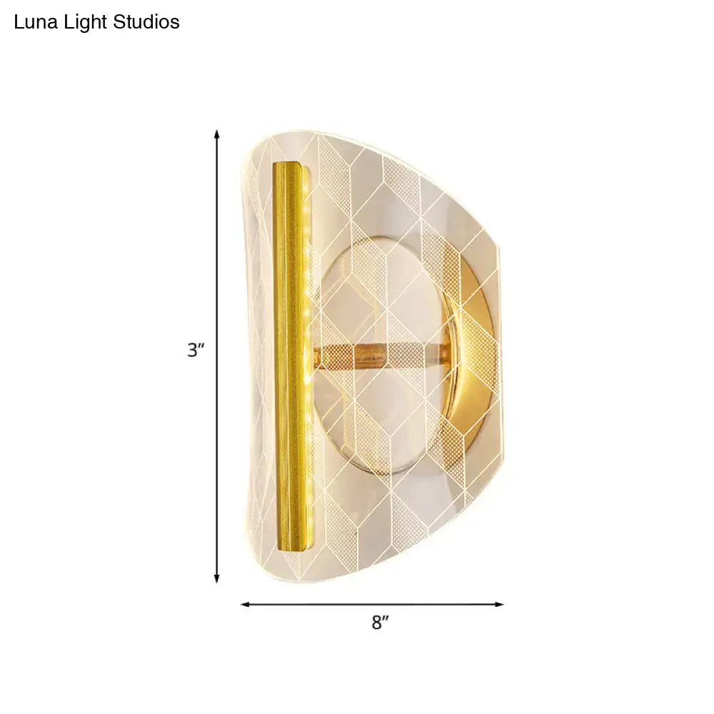 Modern geometric gold sconce light with frosted glass diamond pattern and polished metal trim for living room use