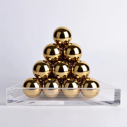 Modern geometric gold tower set featuring polished gold metallic spheres on a clear acrylic base for decorbites geometric gold decor