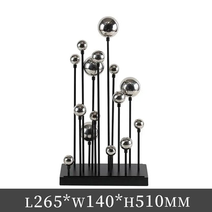 Modern geometric golden ball sculpture with varying sizes on black rods and base for living room metal decor