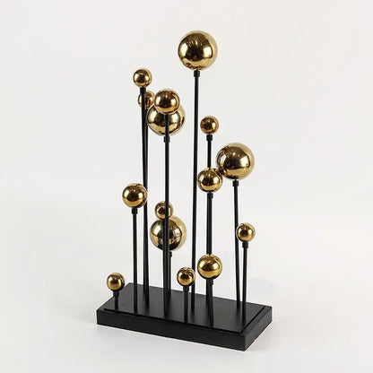Modern abstract geometric golden ball sculpture with polished gold spheres on black rods for living room decor