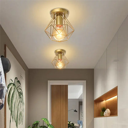 Modern geometric brass ceiling light with decorbites iron frame cage and exposed bulb for aisle and loft lighting