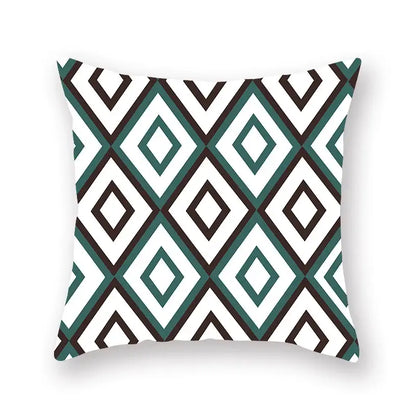 Square throw pillow with bold teal white and black geometric leaf flower pattern for modern decorbites living room decor
