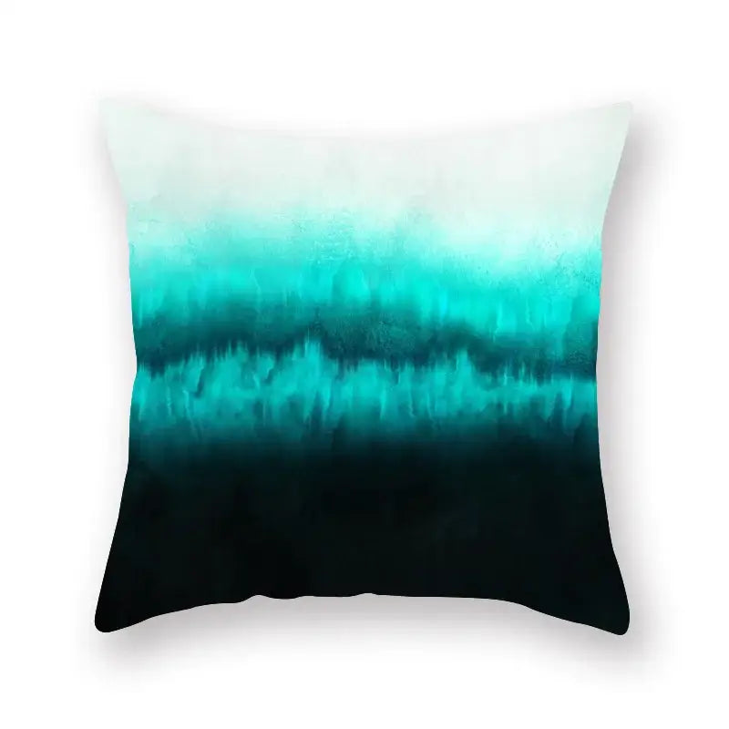 A square throw pillow with a gradient teal blue geometric leaf flower pillowcase featuring abstract watercolor decorbites design