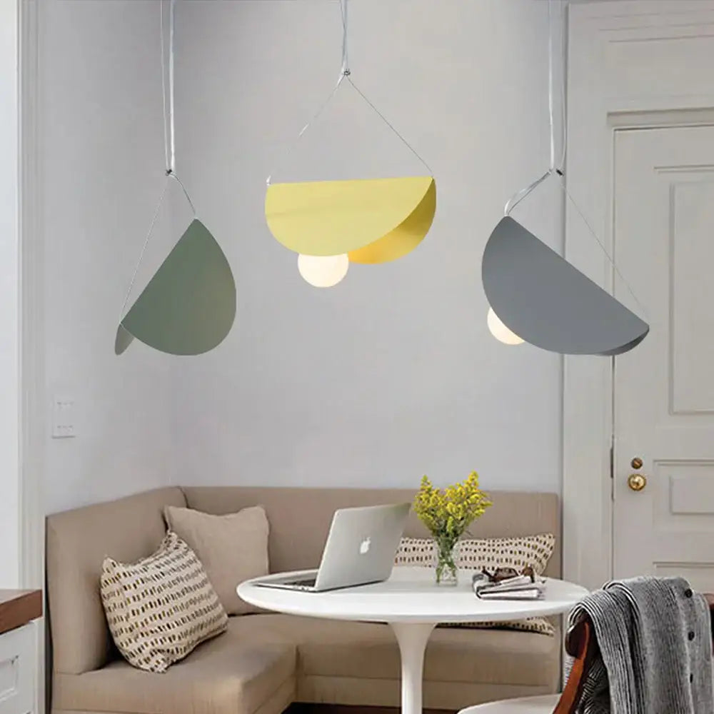 Three modern pendant lights with matte green yellow and gray semi-circular shades decorbites geometric led pendant for dining room
