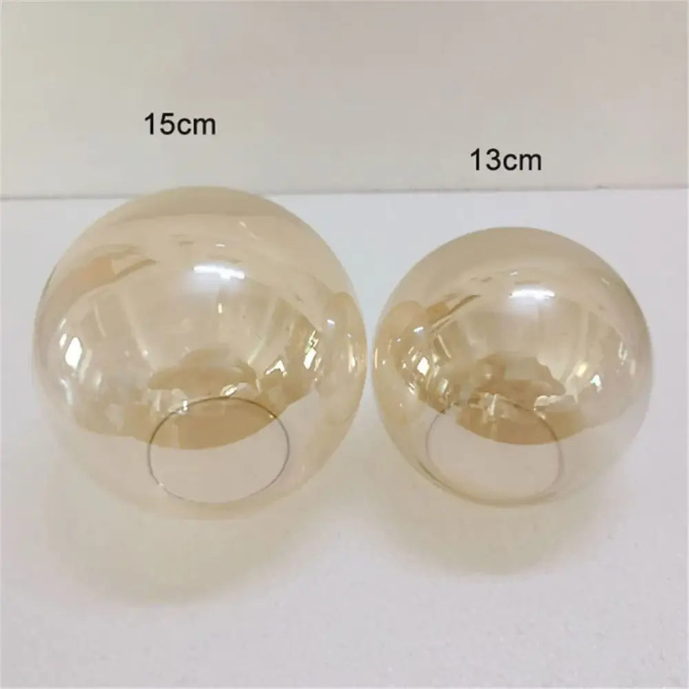 Two translucent amber glass globe lamp shades 15cm and 13cm diameter for modern geometric magic bean lighting