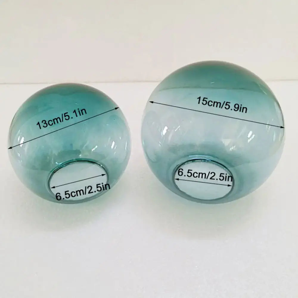 Two translucent teal glass spheres 13cm and 15cm diameter in modern geometric magic bean lighting design