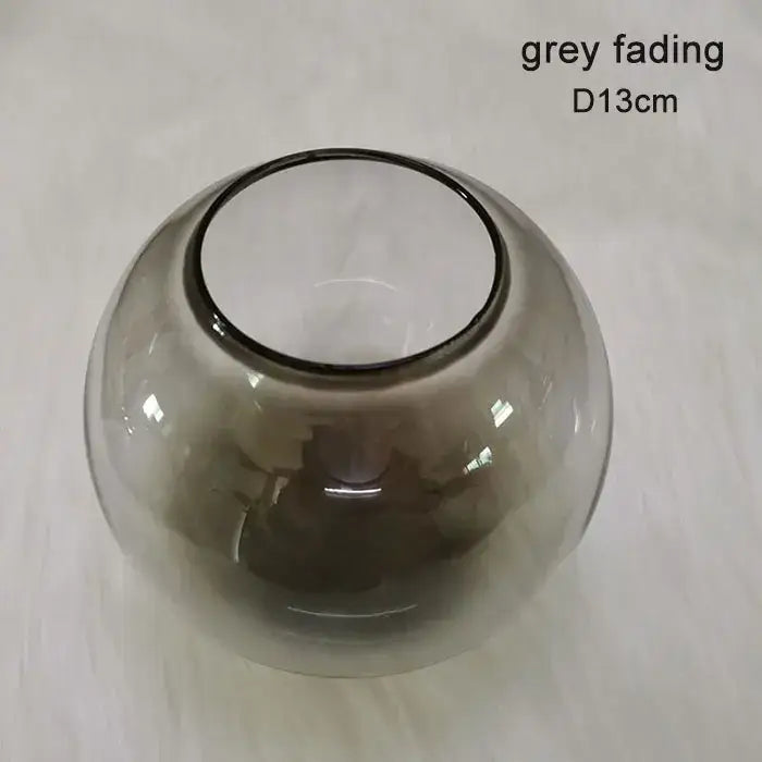 A sleek 13cm spherical glass vase with grey fading and transparent finish for modern magic bean lighting