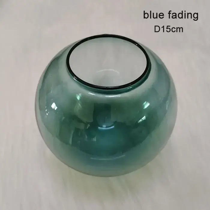 A translucent blue glass vase with a smooth body and black rim as part of modern geometric magic bean lighting