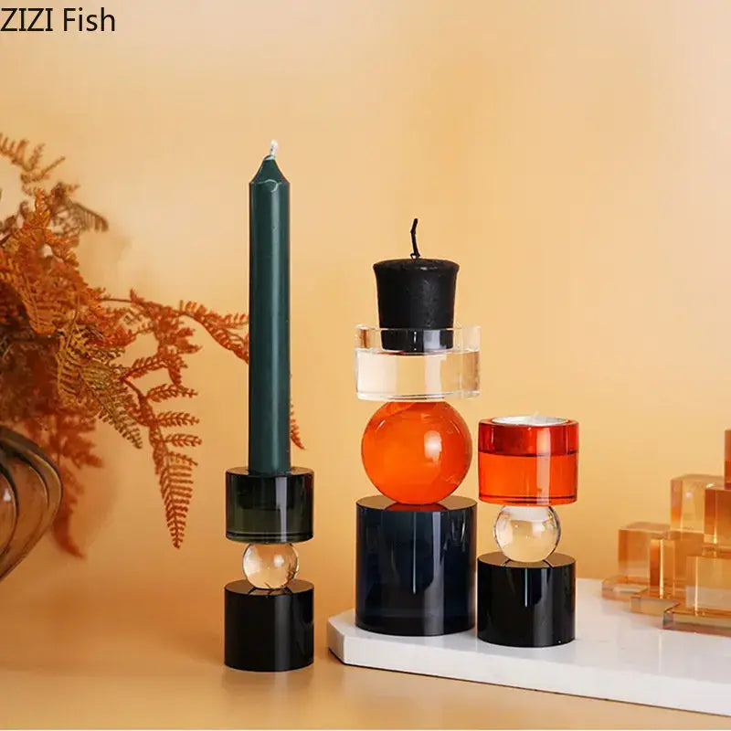 Modern geometric orange and black crystal candle holders in translucent acrylic with stacked spherical and cylindrical designs for dining room