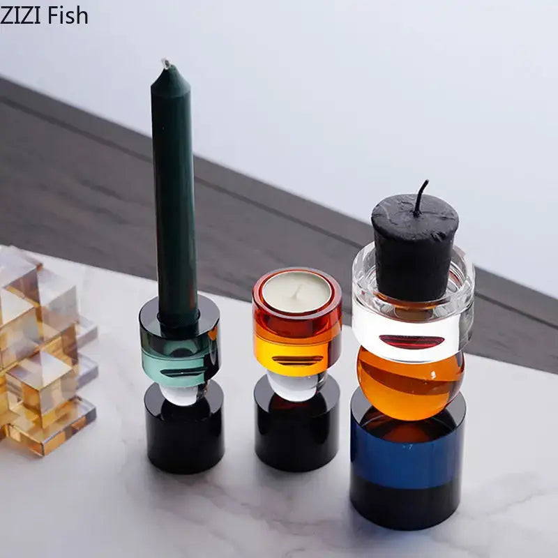 Modern geometric crystal candle holders with stacked translucent segments in orange teal and blue for dining rooms