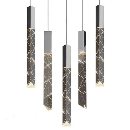 Modern geometric silver crystal glass led pendant light with gold accents providing warm dining room ambient decorbites light
