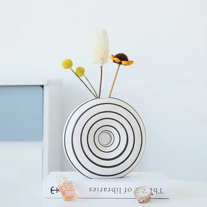 White ceramic vase with geometric stripes featuring concentric black circular bands for living room decorbites decor