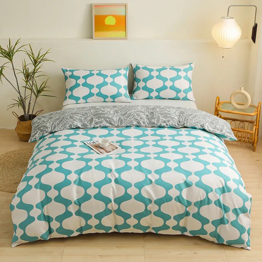 Modern geometric triangle block print bedding set featuring teal and white duvet cover with matching pillowcases