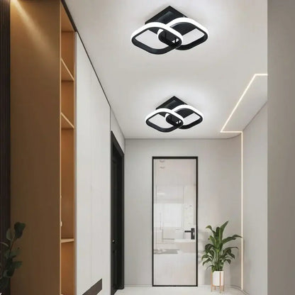 Modern geometric black and white decorbites acrylic led ceiling lamp with sleek interlocking design for bedroom decor