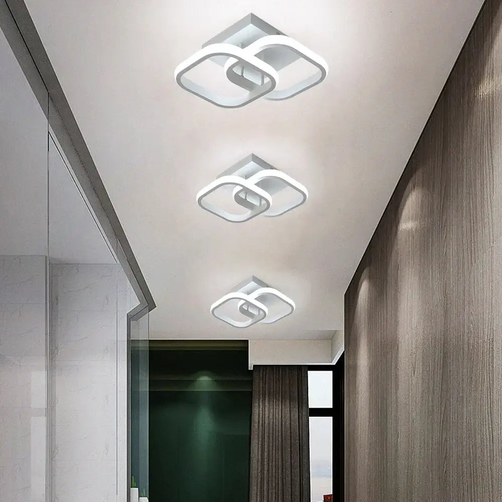 Modern white acrylic led ceiling lamp with interlocking geometric designs for bedroom lighting by decorbites acrylic led