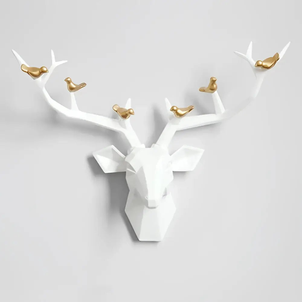 Modern geometric white and gold deer head wall decor with gold birds perched on antlers for living room use