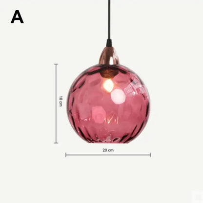 Modern glass ball lustre pendant lights featuring a textured pink glass ball with copper fixture for kitchen decorbites pendant lights