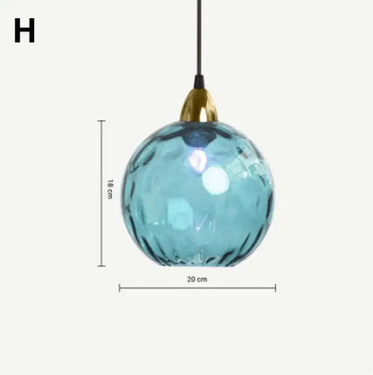 Modern glass ball lustre pendant lights featuring a textured blue glass ball with gold-toned metal fixture decorbites glass ball