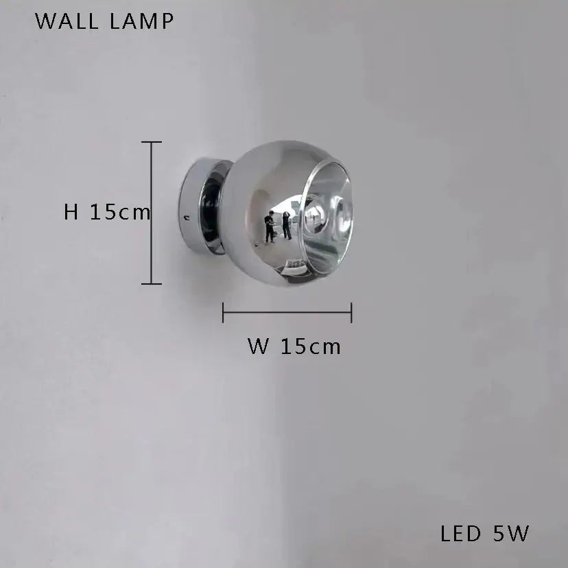 A sleek spherical chrome wall lamp with a reflective surface and led 5w bulb for decorbites glass bubble ceiling chandelier