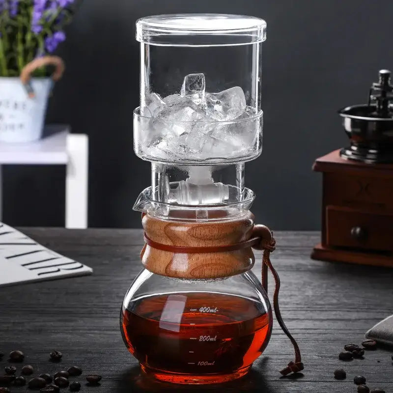 Modern glass coffee kettle dripper with clear glass, wooden collar, and brown leather strap for decorbites glass coffee use