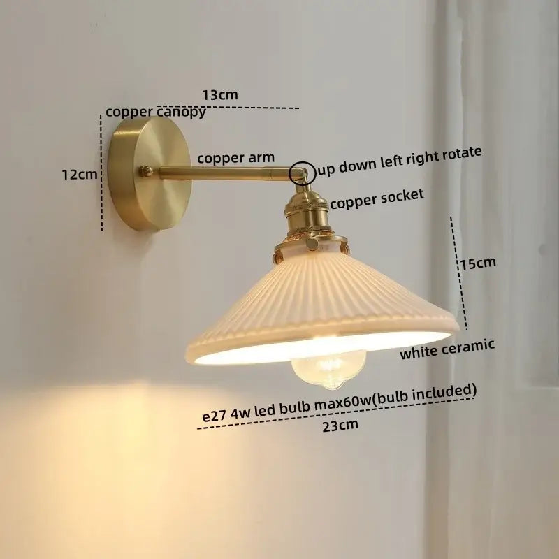 A vintage-style wall light with a brass copper led arm and white ceramic shade for bedroom reading