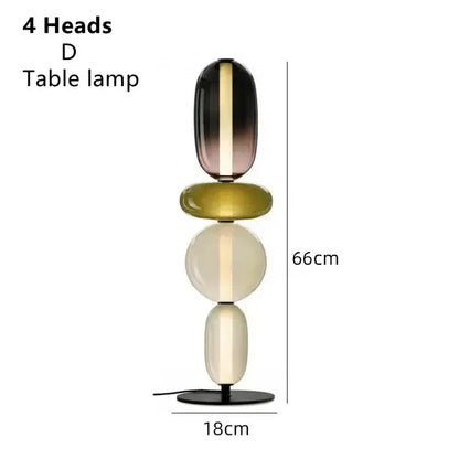 Modern glass floor lamp led with four stacked oval glass heads in black olive green and cream for living room use