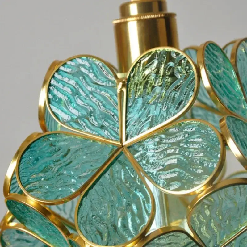 Modern glass flower led pendant light with teal glass clover shape and gold accents for dining room lighting