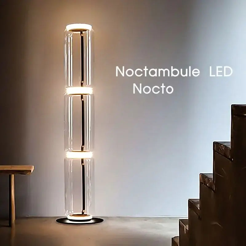 A sleek modern glass led floor lamp with three cylindrical sections and warm glowing rings for living room use