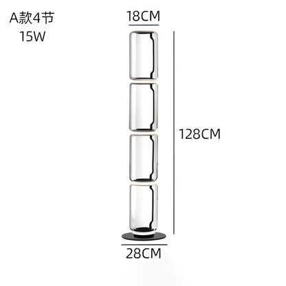 A sleek modern led floor lamp with four transparent glass sections and a black base for living room use