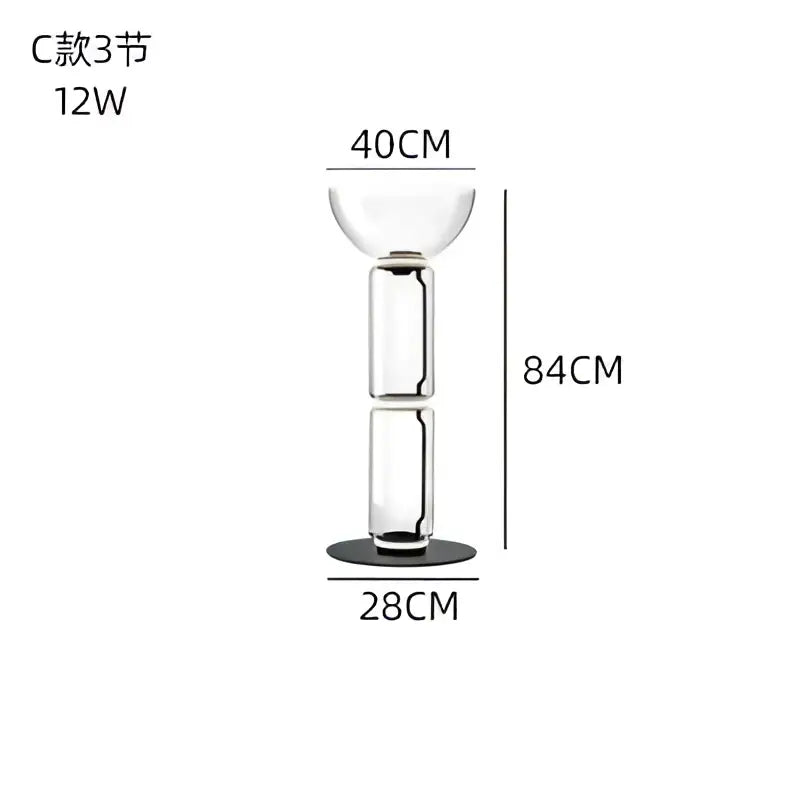 A sleek modern glass led floor lamp with three stacked cylindrical sections and a black base for living room use