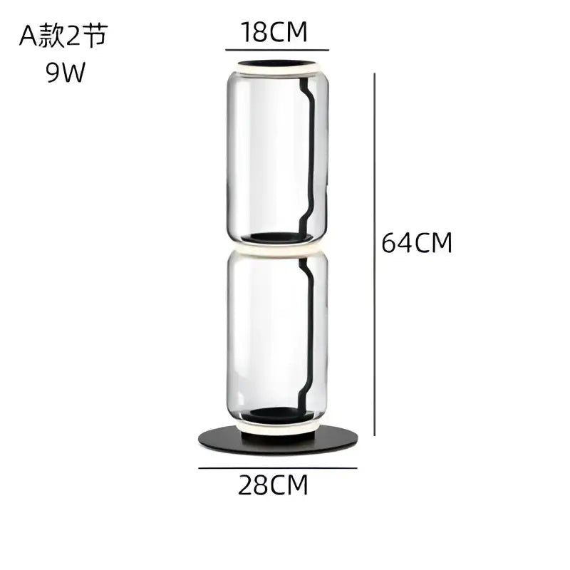 A modern glass led floor lamp with a sleek transparent glass vase and black base for living room use