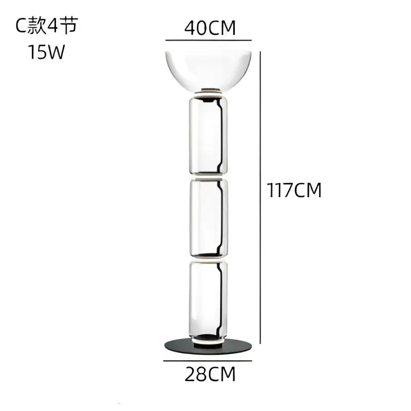 Modern glass led floor lamp with tall transparent segmented glass candle holder and black base for living room use