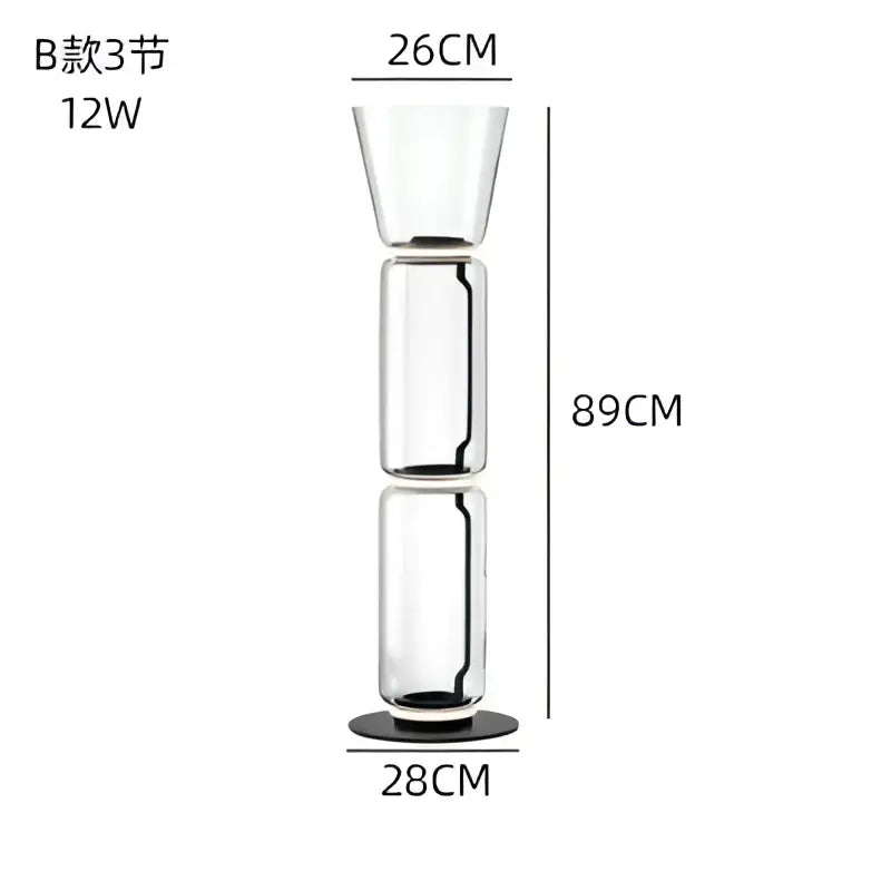 Modern glass led floor lamp with tall transparent three-section design and black base for living room use