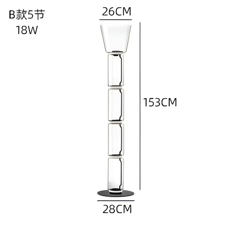 A modern glass led floor lamp with glowing rings features a tall transparent segmented design and black base